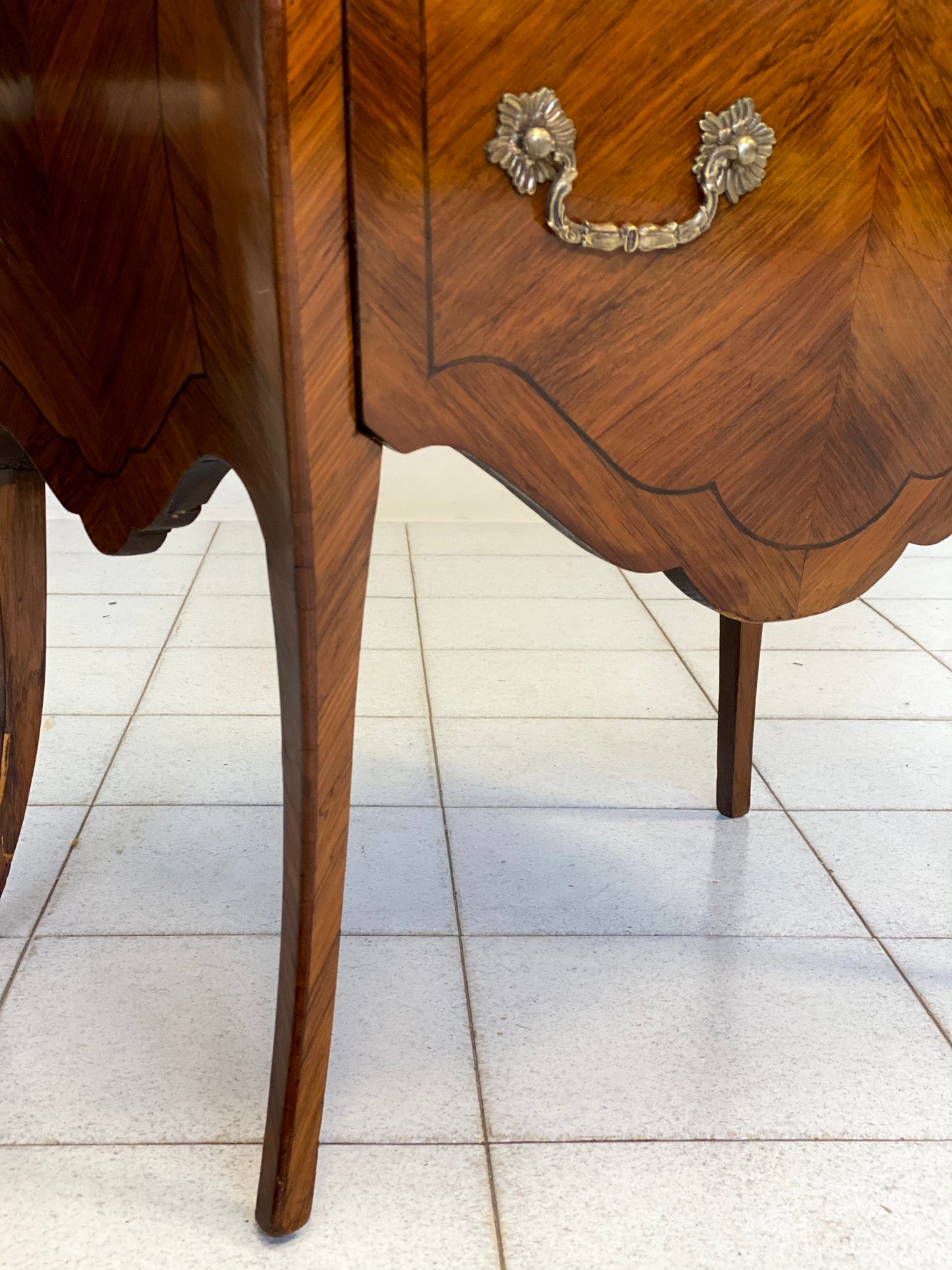 Curved chest of drawers, veneered and inlaid, mid-19th century. Restored