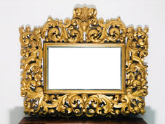 Specchiera in legno intagliato e dorato . Modena Bologna primi 700