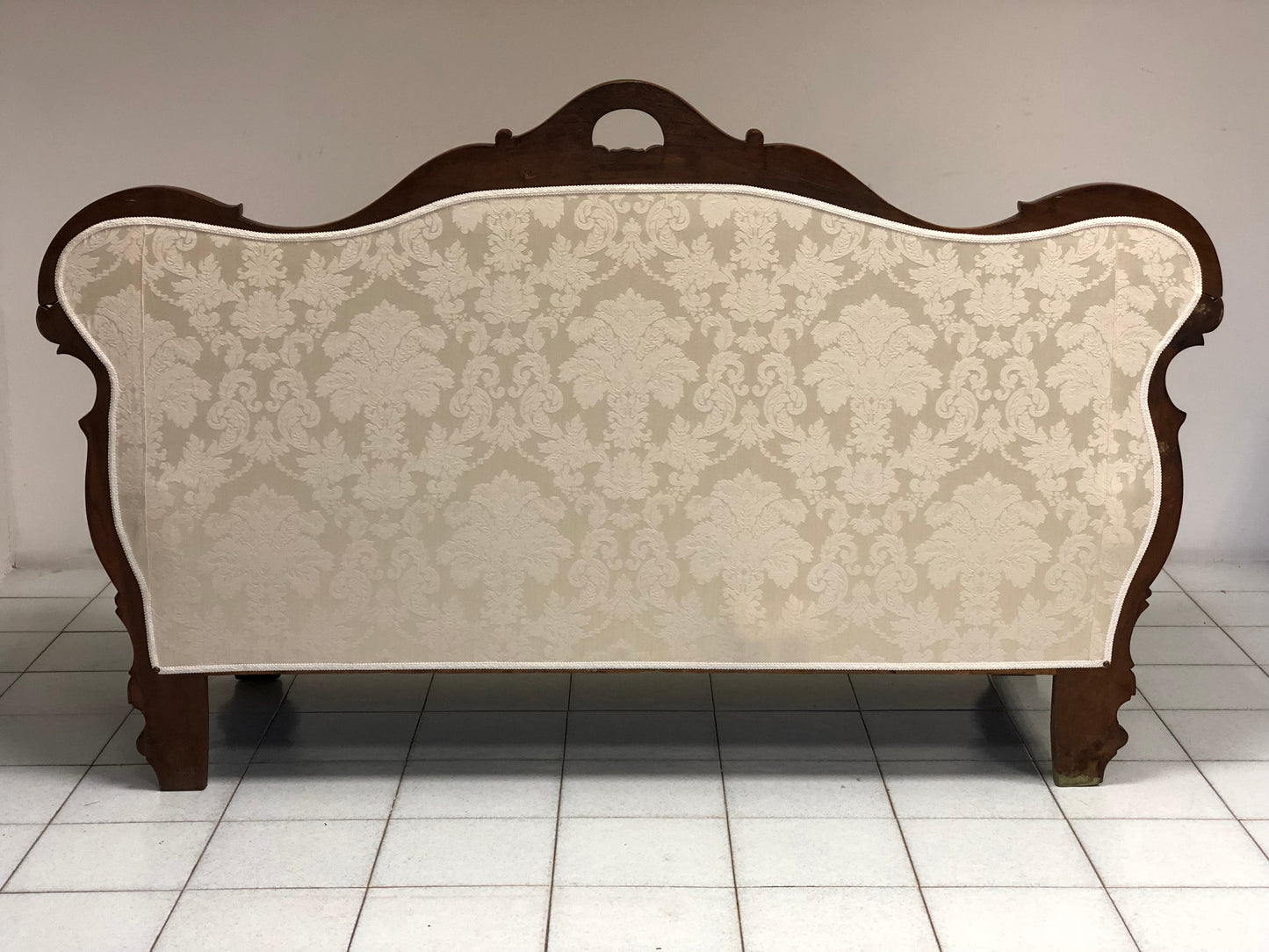 Lombardo walnut boat sofa. Early 19th century