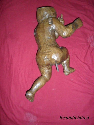 Putto in legno di noce del Cinquecento