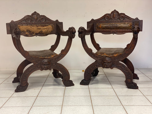 Pair of carved walnut Savonarole armchairs. 17th century
