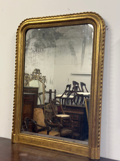Specchiera in legno intagliato dorato con treccia sui lati  XIX secolo