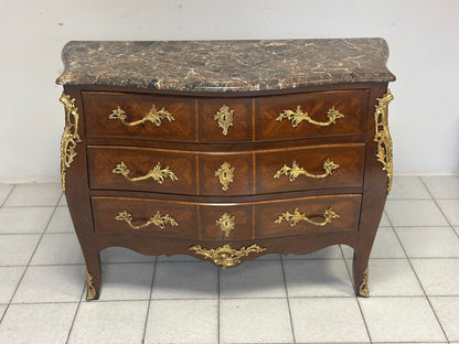 Cassettone a forma bombata bois  de rosa ebano viola 
XIX secolo Napoleone III (restaurato)