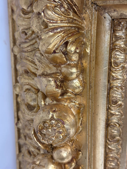 Specchiera in legno intagliato e dorato . Lombardia XIX secolo