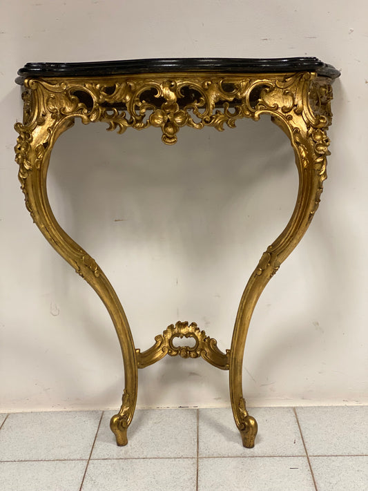 Drop-shaped console table in carved and gilded wood. Early 19th century