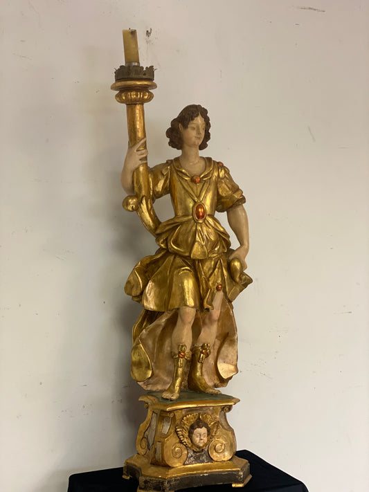 Angel candle holder lacquered gold in carved wood. Central Italy first half of the 17th century. Height 124 cm