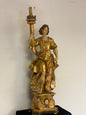 Angel candle holder lacquered gold in carved wood. Central Italy first half of the 17th century. Height 124 cm