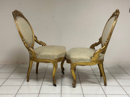 Coppia di poltrone in legno intagliato e dorato.  XIX secolo