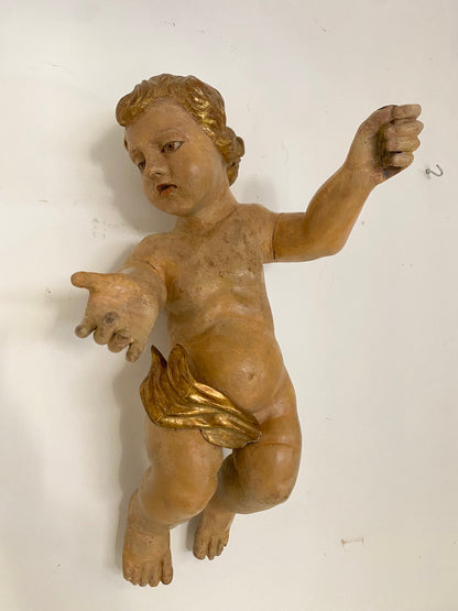 Wooden cherub putto carved, lacquered and gilded. 17th century Lombardy