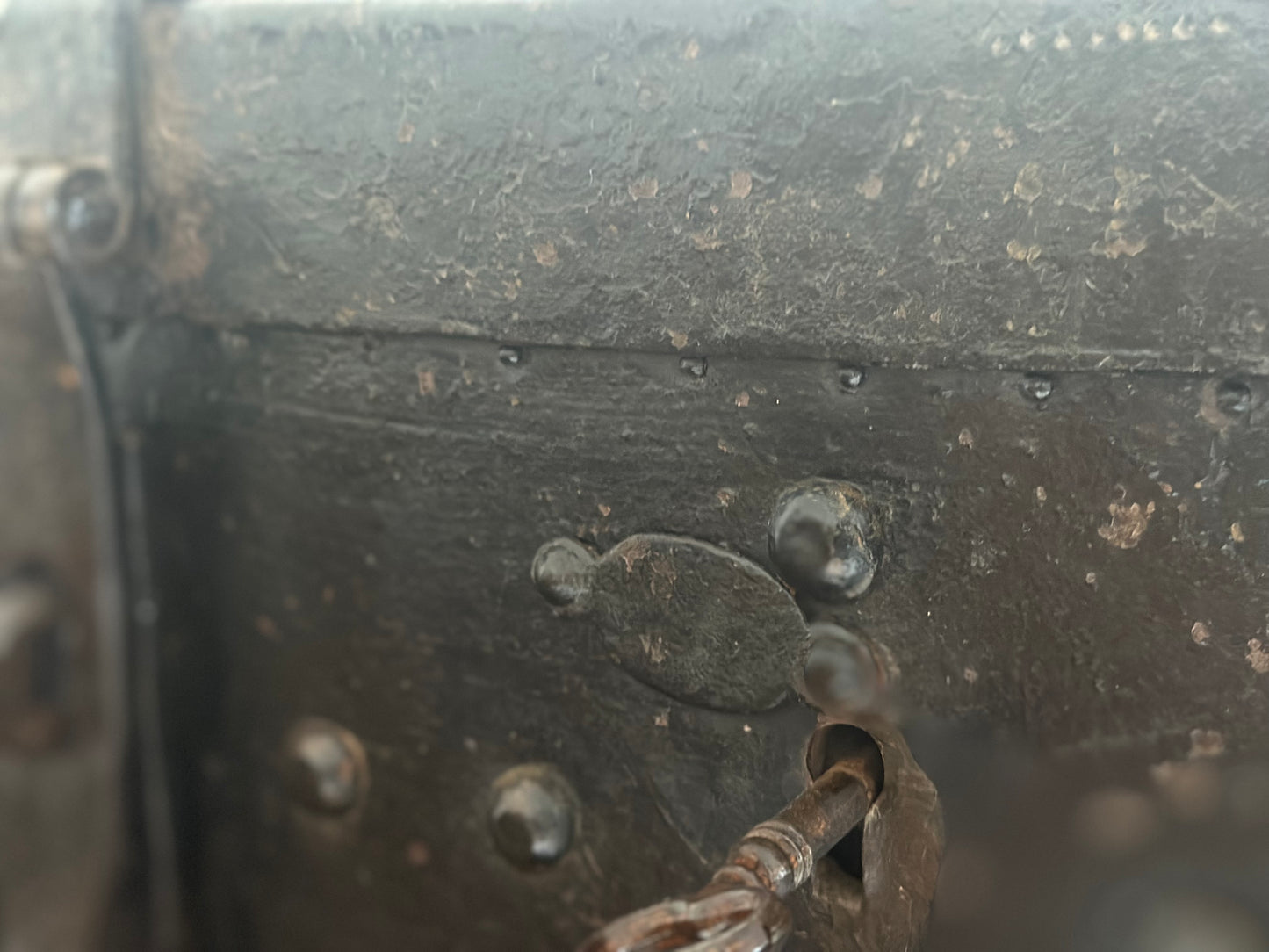 Small studded iron travel chest. Early 19th century