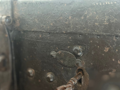 Small studded iron travel chest. Early 19th century