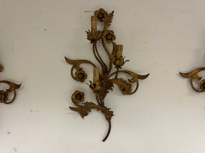 Tre appliques in metallo dorato a motivi floreali.   XIX secolo