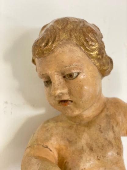 Wooden cherub putto carved, lacquered and gilded. 17th century Lombardy