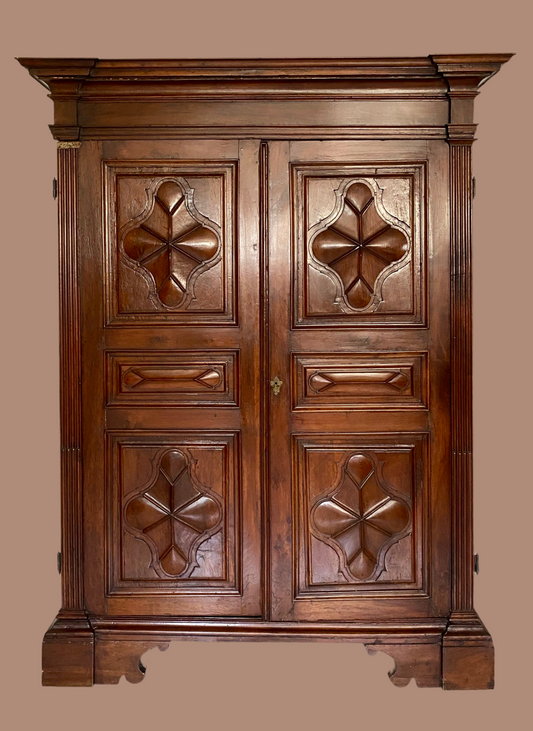Walnut wardrobe with diamond-tip carving and panelling. Genoa, 17th century