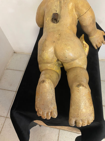 Wooden cherub putto carved, lacquered and gilded. 17th century Lombardy