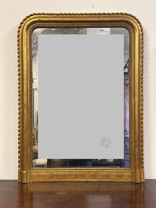 Specchiera in legno intagliato dorato con treccia sui lati  XIX secolo