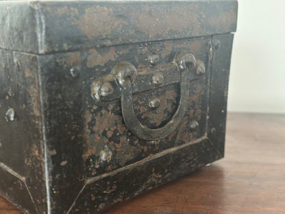 Small studded iron travel chest. Early 19th century
