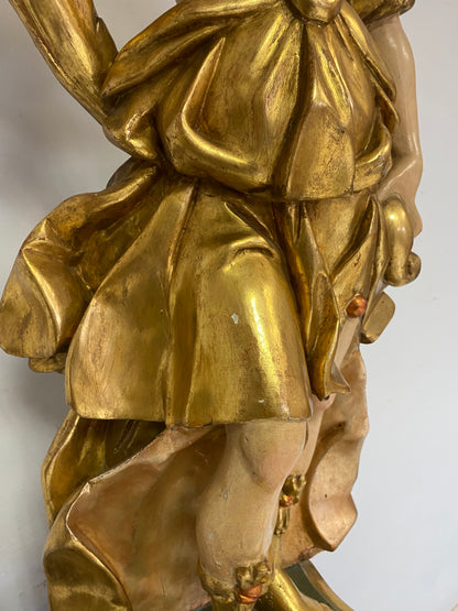 Angel candle holder lacquered gold in carved wood. Central Italy first half of the 17th century. Height 124 cm
