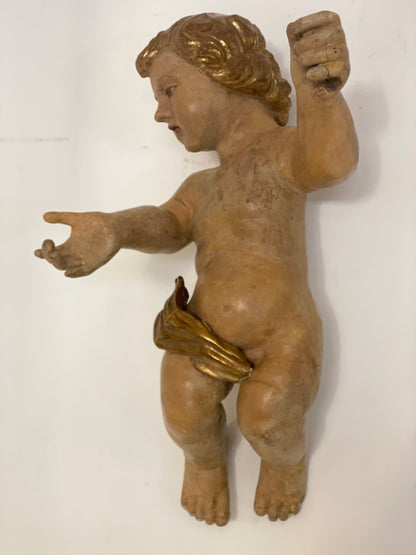 Wooden cherub putto carved, lacquered and gilded. 17th century Lombardy