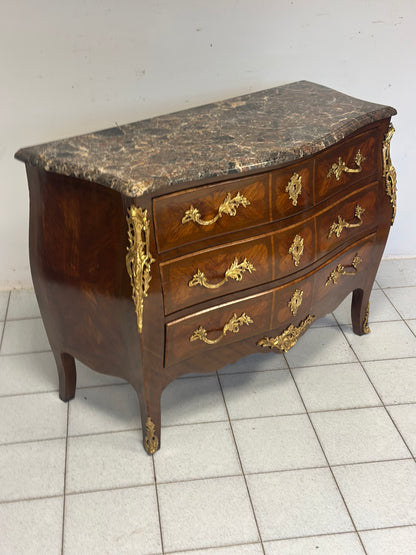 Cassettone a forma bombata bois  de rosa ebano viola 
XIX secolo Napoleone III (restaurato)