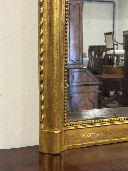 Specchiera in legno intagliato dorato con treccia sui lati  XIX secolo