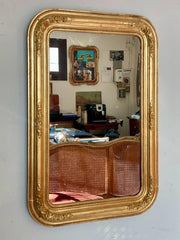 Specchiera dorata con fregi . XIX secolo