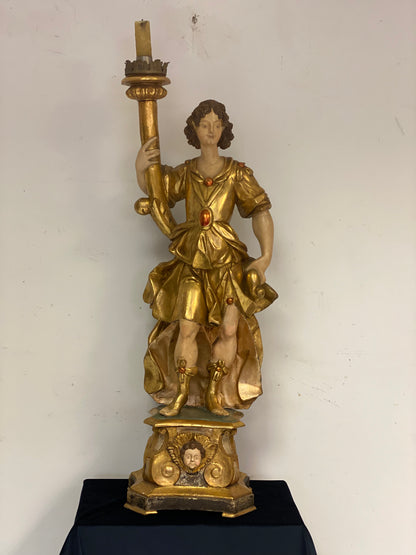 Angel candle holder lacquered gold in carved wood. Central Italy first half of the 17th century. Height 124 cm