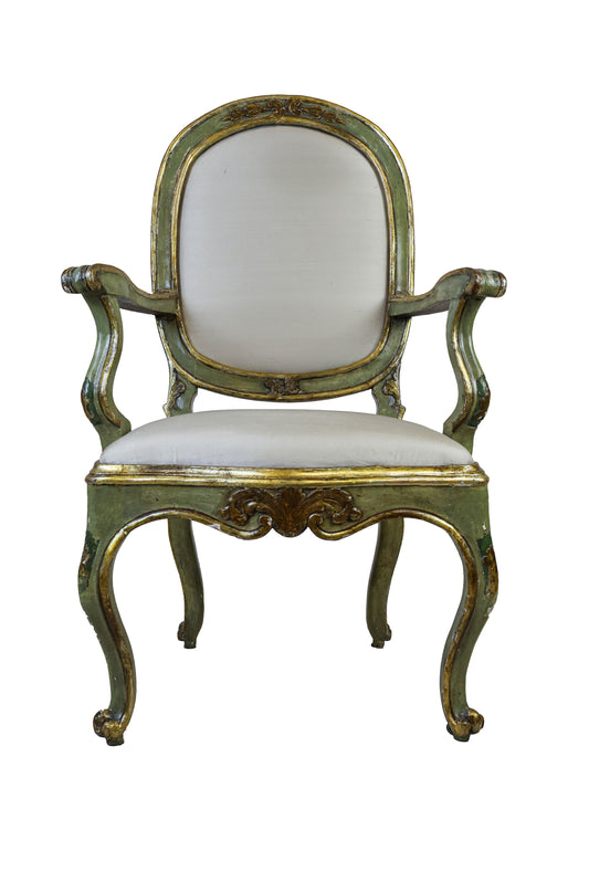 Louis XV armchair in carved wood lacquered in gold. Early 18th century.