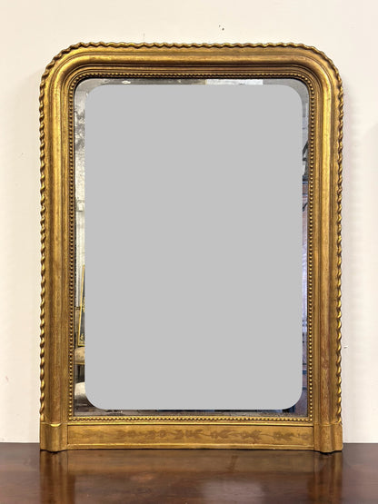 Specchiera in legno intagliato dorato con treccia sui lati  XIX secolo