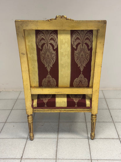 Poltrona Napoleone III in legno intagliato e dorato