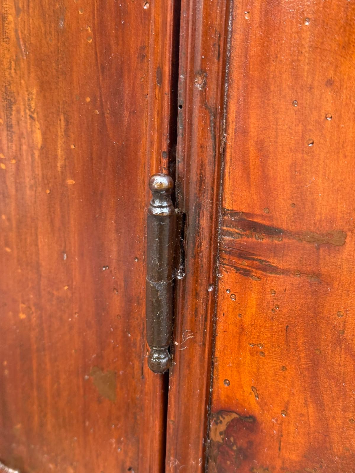 Corner cupboard in walnut curved on the front. Genoa 18th century