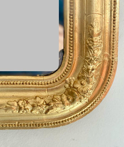Gilded mirror with friezes. 19th century