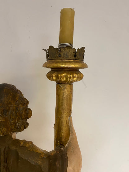 Angel candle holder lacquered gold in carved wood. Central Italy first half of the 17th century. Height 124 cm