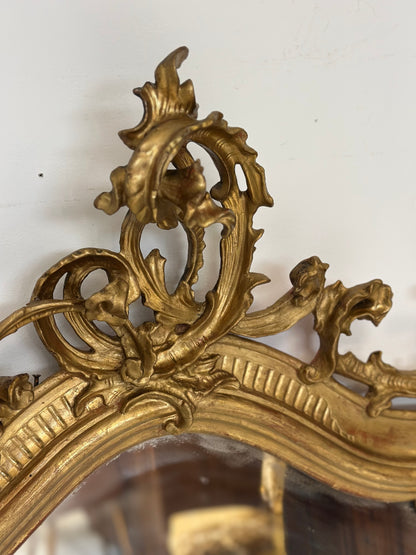 Specchiera caminiera lignea intagliata dorata . XIX secolo.  Restaurata
