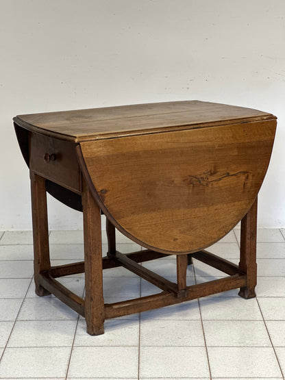 Walnut hinged table. 17th century
