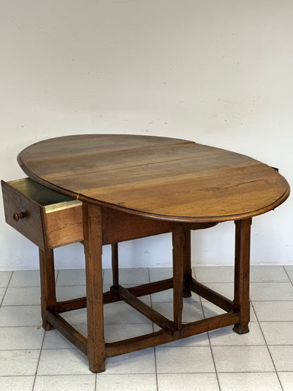 Walnut hinged table. 17th century
