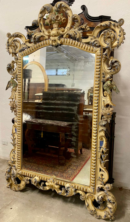 Carved wooden mirror, gilded and lacquered. Lombardy, Piedmont, early 19th century