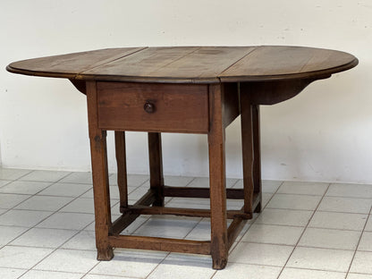 Walnut hinged table. 17th century