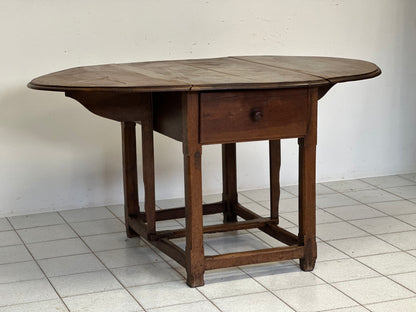 Walnut hinged table. 17th century