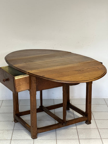 Walnut hinged table. 17th century