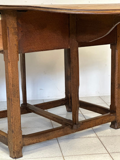 Walnut hinged table. 17th century