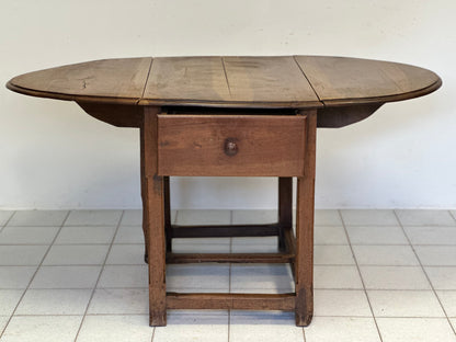 Walnut hinged table. 17th century