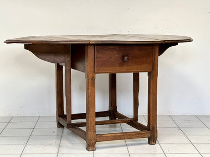 Walnut hinged table. 17th century