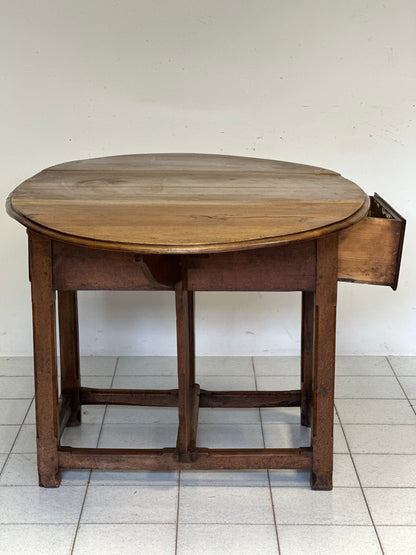 Walnut hinged table. 17th century