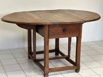 Walnut hinged table. 17th century