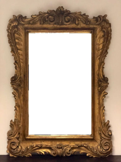 Carved and gilded wooden mirror. Lombardy 19th century