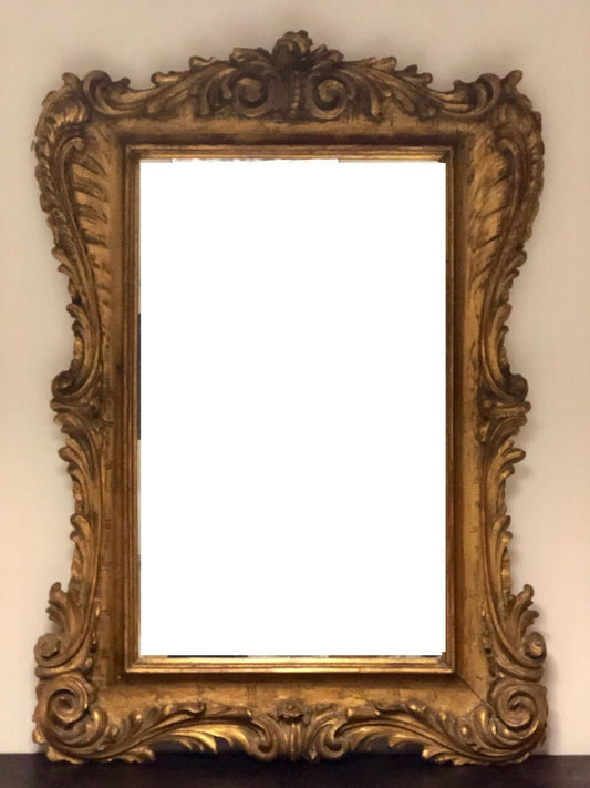 Carved and gilded wooden mirror. Lombardy 19th century