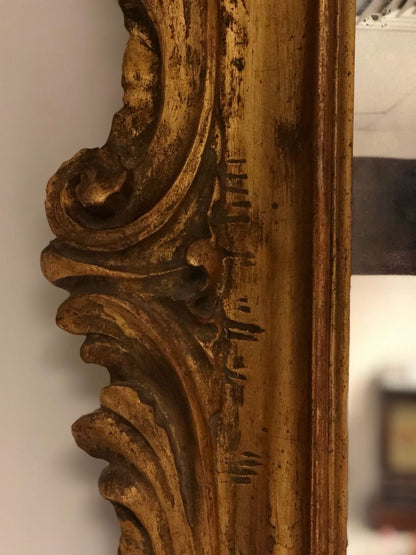 Carved and gilded wooden mirror. Lombardy 19th century