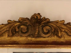 Specchiera in legno intagliato e dorato . Lombardia XIX secolo