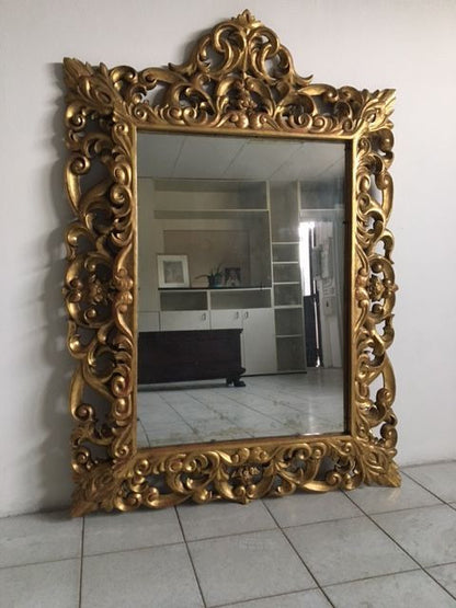 Carved and gilded wooden mirror in gold leaf 19th century